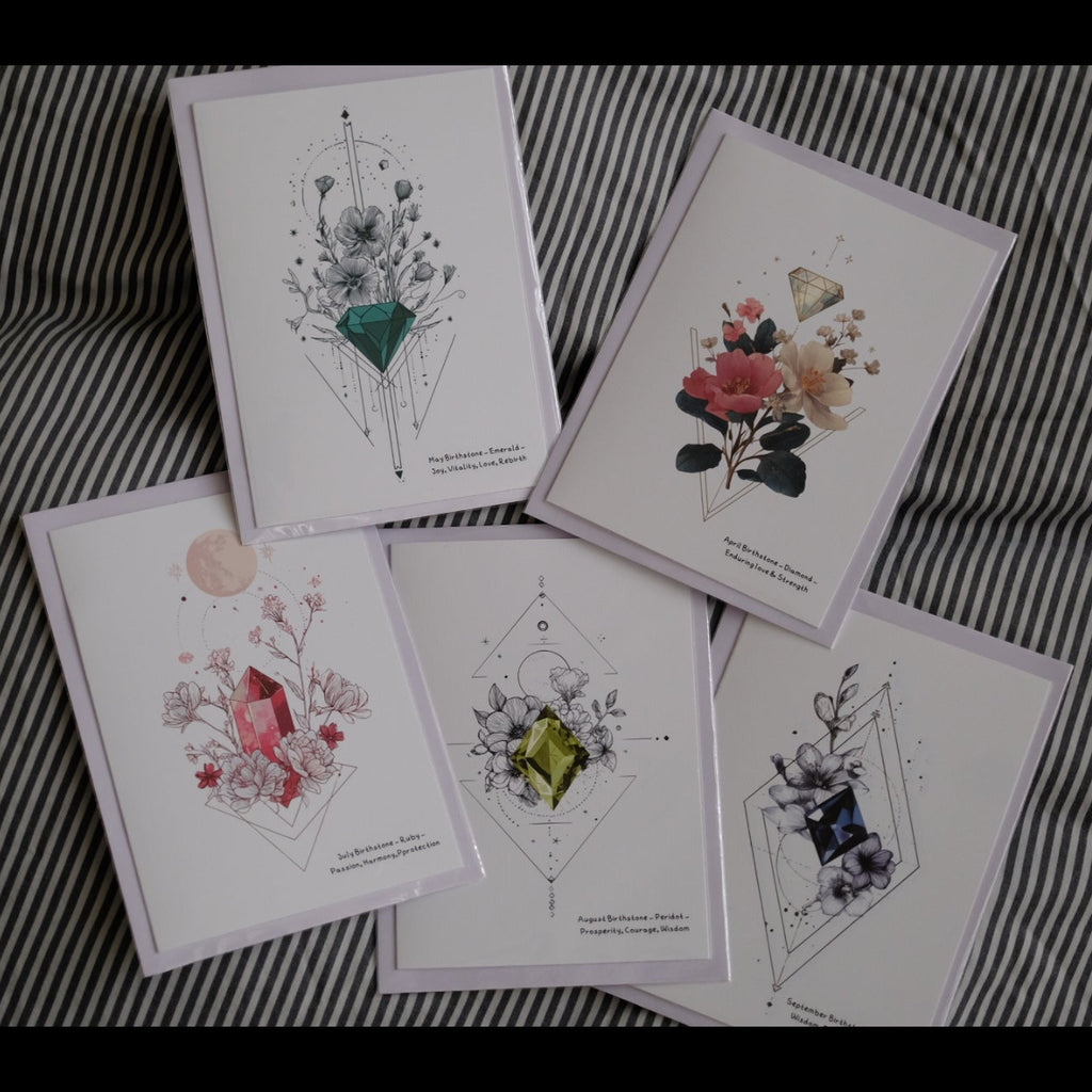 Set of floral and botanical illustration cards on a striped fabric background